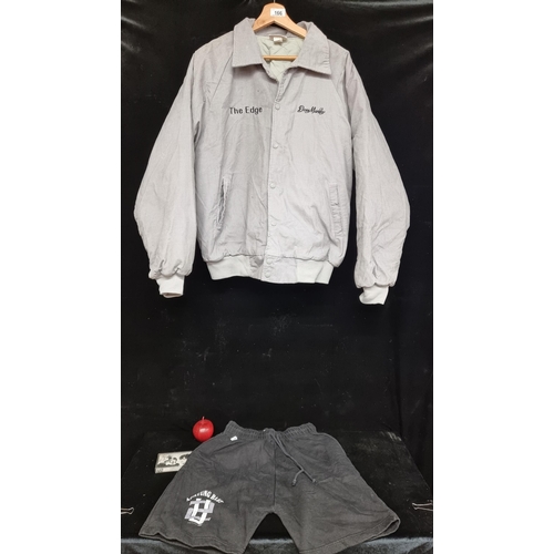 166 - Star Lot : A vintage U2 Dean Markley bomber jacket. In a soft grey corduroy, with the words ''The Ed... 