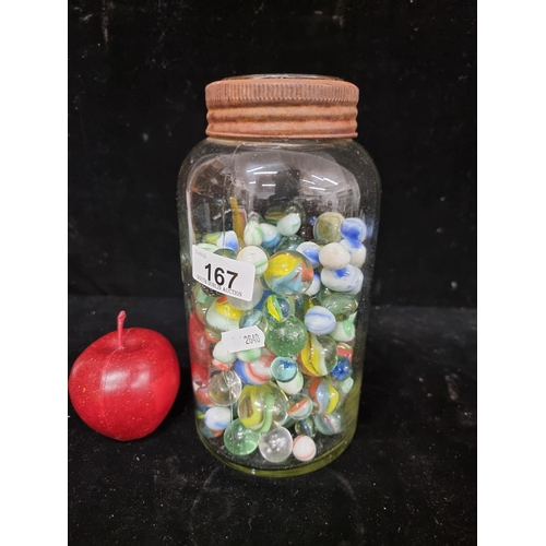 167 - A large number of vintage marbles in various sizes, swirls and colours In a glass bottle