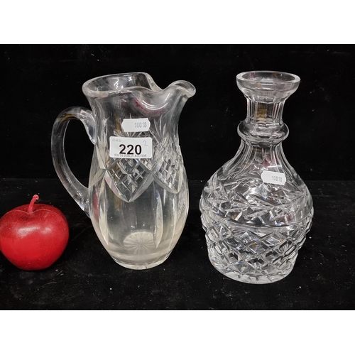 220 - Two items of Waterford Crystal, including a hand-blown martini pitcher with a criss-cross and fan cu... 