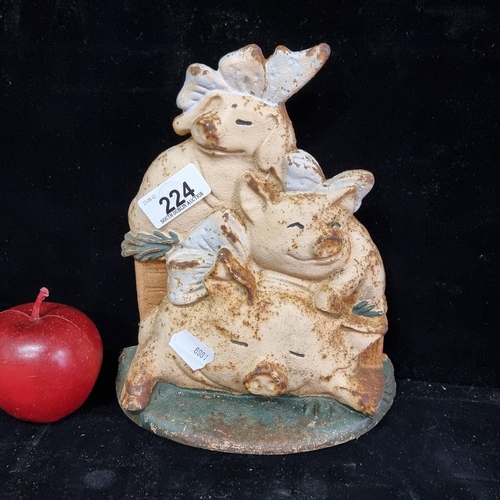 224 - A charming and very heavy cast iron farmhouse kitchen door stop depicting ''Three Little Pigs''.