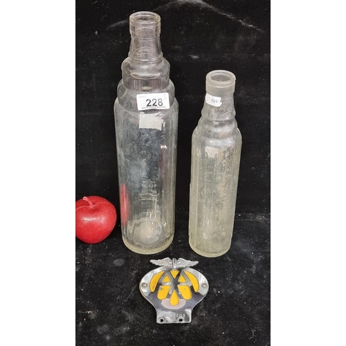 228 - A good lot of motoring collectibles including two vintage ESSO oil bottles and an AA grill badge fro... 