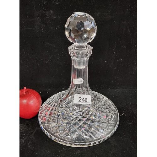 240 - A very elegant example of a ship's decanter by Waterford Crystal in their Lismore pattern with disti... 