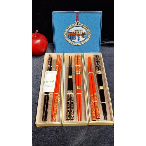 259 - A selection of four items including three sets of ornately decorated chopsticks and a White House Ch... 