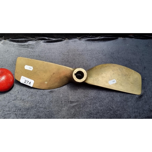 274 - A vintage two blade boat propeller. Stamped ''TE 15467'' and ''15.5x10LH''. Heavy solid brass.