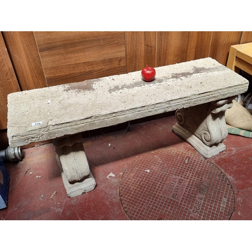 276 - Star Lot : An incredibly heavy stone garden bench resting on substantial double scroll legs. L113 cm... 