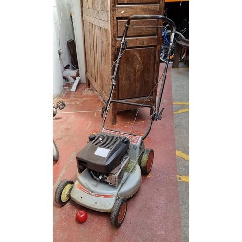 284 - A maxicatch petrol 500 lawn mower with quick blade system.