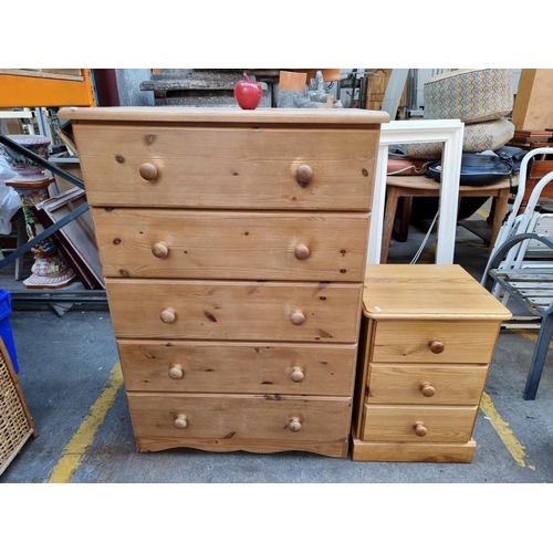 292 - A five drawer solid pine chest of drawers with pull handles and a pine 3 drawer bedside locker (2)