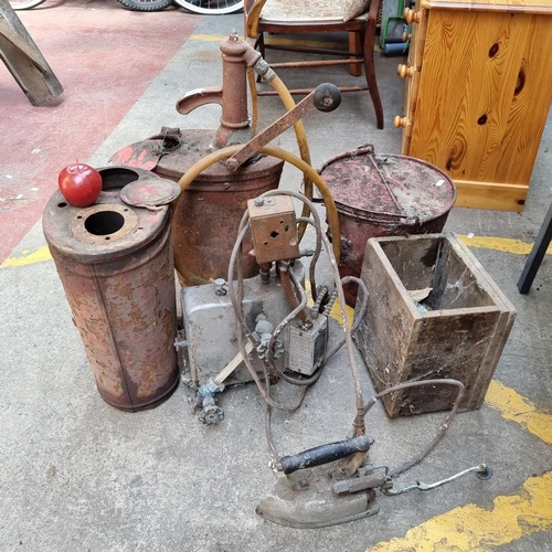 293 - A vintage garage forecourt oil dispenser pump, along with an additional pump base, and vintage steam... 