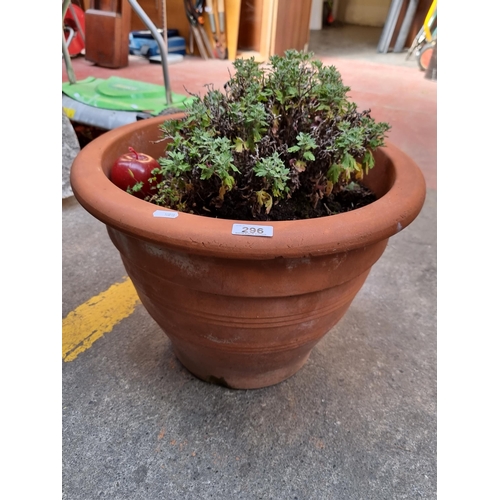 296 - A very large terracotta planter. H 33 x W 47 cm