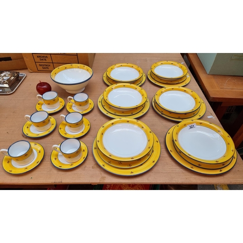 321 - 31 pieces of dinnerware with Grange marked to base, with a delightful red floral pattern on yellow g... 