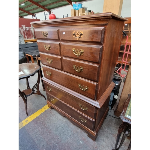 330 - A handsome wooden tallboy with five drawers, pierced brass escutcheons  and brass drop handles.
DM H... 