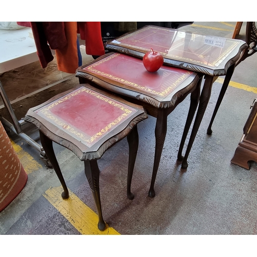 332 - A set of three wooden nesting tables, with carved edges and cabriole legs. These tables are further ... 