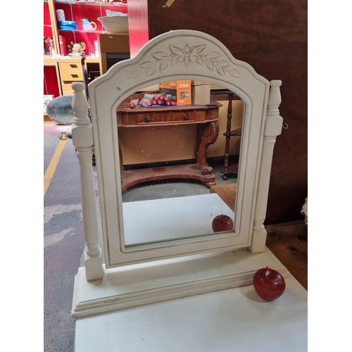 342 - A lovely adjustable vanity mirror with a carved floral design in a white finish.