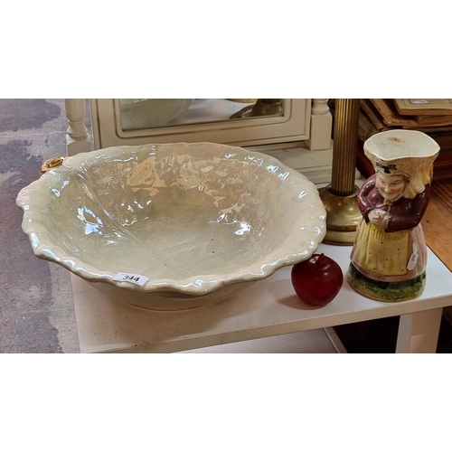 344 - A huge beautiful white large  leaf-shaped wash basin with white lustre glaze and an antique Toby jug... 