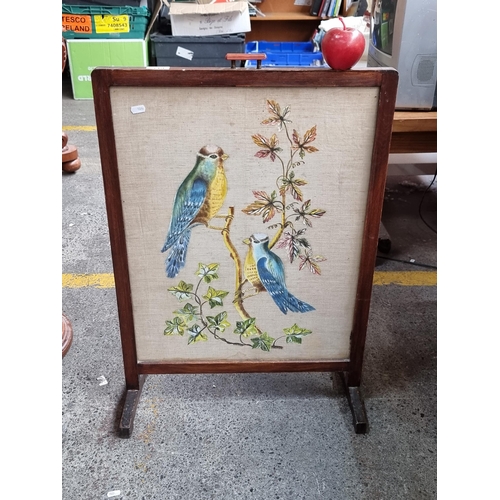 348 - A Lovely embroidered fire screen with blue birds.