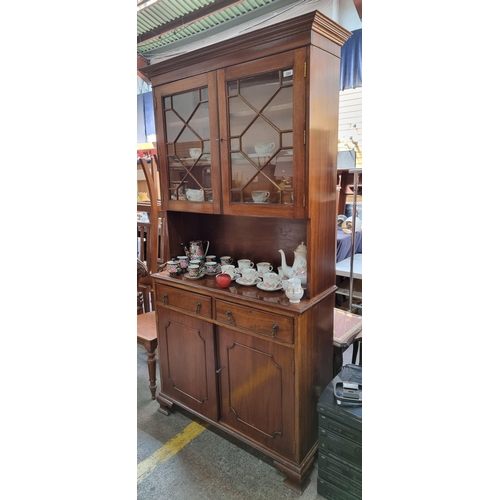 359 - An impressive Duncan Phyfe style china cabinet. With an astro-glaze top cupboard, two pullout drawer... 