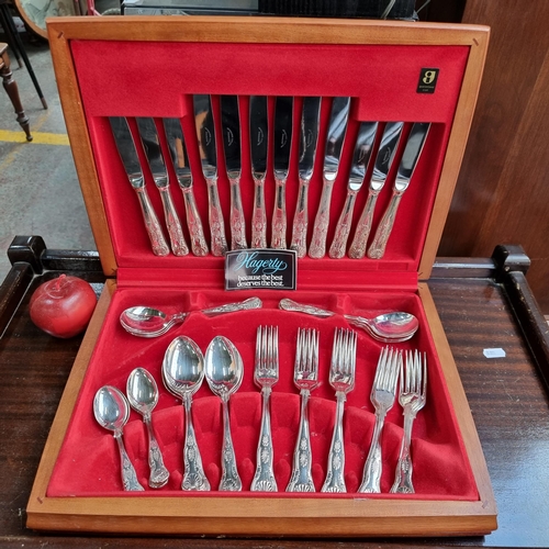 362 - An elegant Newbridge canteen of cutlery. Forty-one pieces cased in an attractive red interior.