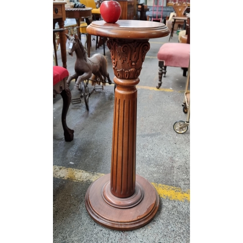 380 - A fantastic wooden plant stand in the style of a classical Grecian column. Richly carved with a deep... 