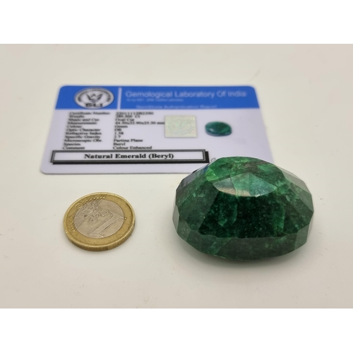 402 - A Large natural oval cut Emerald, with a weight of 289 carats. With GLI cert, stone cold to the touc... 