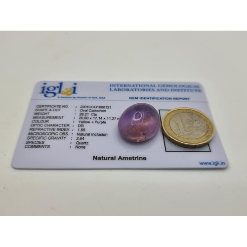 410 - A very attractive natural Ametrine oval cabochon. Weight: 28.1 carats. Comes with IGL certificate.