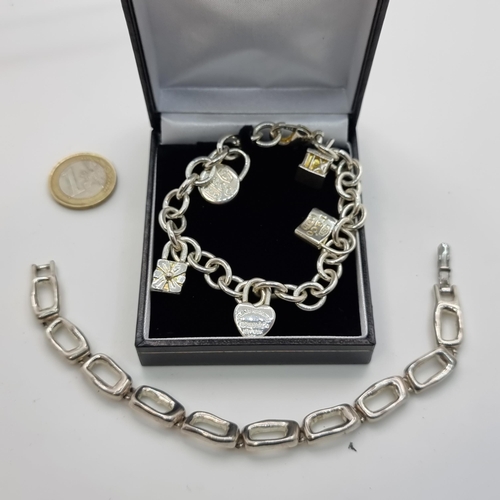 423 - Two sterling silver chain link bracelets. Total weight of silver: 67 grams.