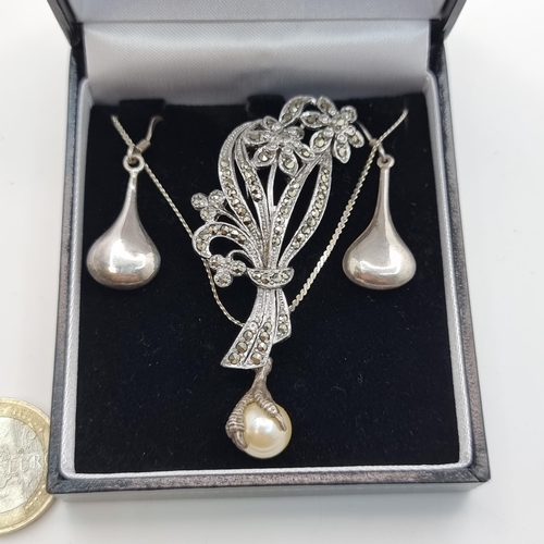 424 - A sterling silver Claw set Pearl necklace. Together with a pair of sterling silver drop earrings and... 