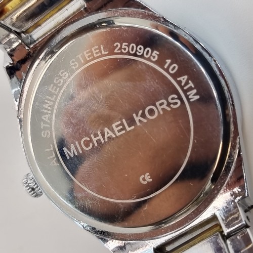 50 - A gentlemen's Michael Kors wrist watch, with a nice jewel set bezel and two toned strap.