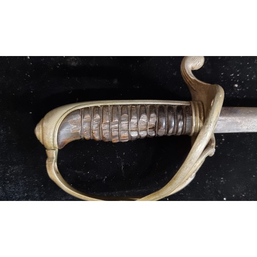 99 - A 19th century French model of Cuirassier Trooper's sword. With a four-bar brass hilt, a wood and br... 