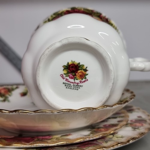 117 - Twenty-two pieces of Royal Albert bone china in the Old Country Roses pattern. A very pretty collect... 