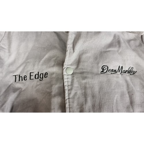 166 - Star Lot : A vintage U2 Dean Markley bomber jacket. In a soft grey corduroy, with the words ''The Ed... 