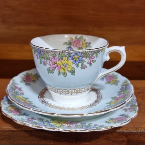 356 - A complete set of twenty-one Colclough China tea set. With delicate floral design against duck egg h... 