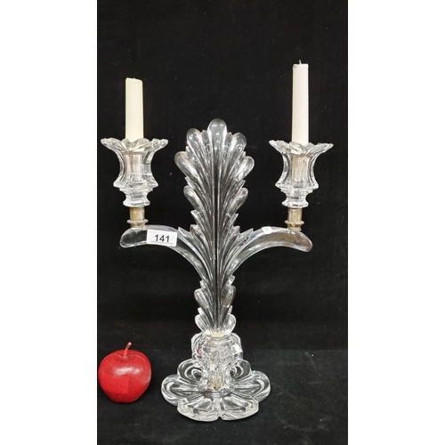 141 - An impressive tall freestanding double candlestick, with a crystal base and stem in the form of a fe... 