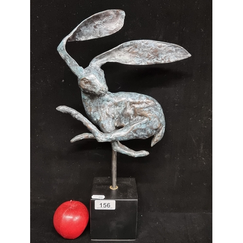 156 - A delightful, freestanding bronze sculpture of an Irish hare. The figure has been captured mid sprin... 