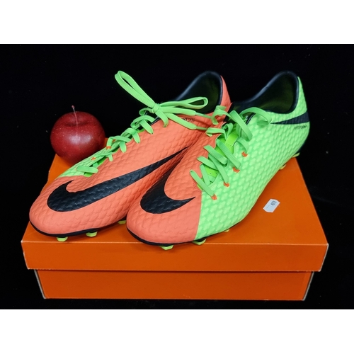 223 - A brightly coloured pair of men's NIKE SKIN football trainers with cleated soles. UK size 11. In lum... 