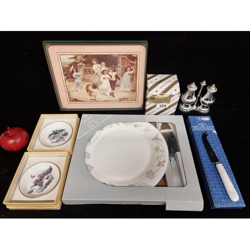 224 - A selection of six boxed homeware items including examples of porcelain by Poole China, and a cheese... 