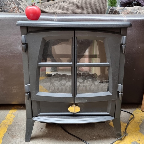 306 - A very practical electric heater in the form of a fire stove, made by Dimplex. Model: JAZ20R. In gre... 