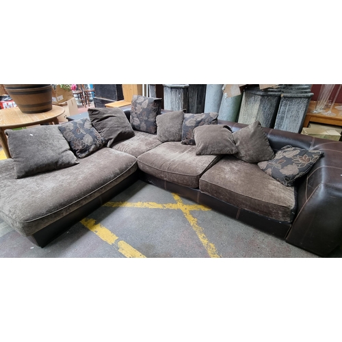 309 - A very large an comfortable plush corner couch (seats 5) with brown leather frame with saddle stitch... 