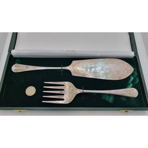 404 - A sterling silver knife and fork set, with a beautiful swirling intricate Celtic design border. Hall... 