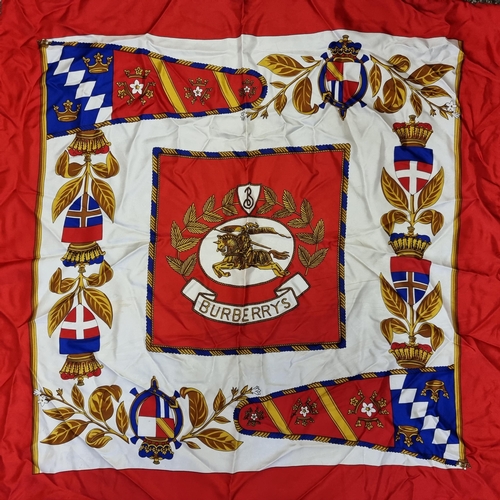 410 - A beautiful Burberry Italian made pure silk scarf, with heraldic coloured design. Measuring 90cm squ... 