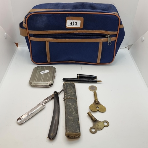 413 - A collection of five items, including two brass clock keys, an open blade razor, a Conway Stuart fou... 