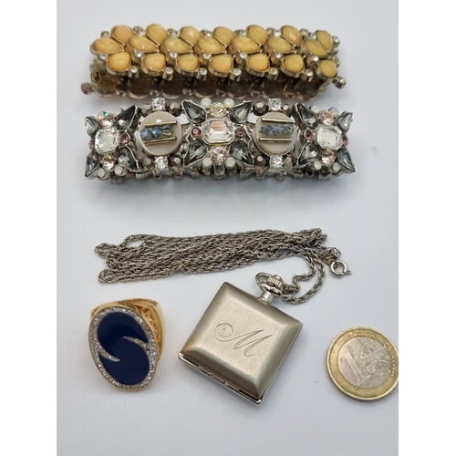 434 - A collection of four vintage costume jewelry items. Consisting of an attractive Quartz pendant watch... 