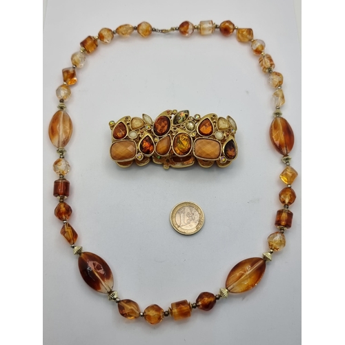 435 - A striking Amber stone style necklace. Length 58cm. Together with an attractive Multi-stone bracelet... 