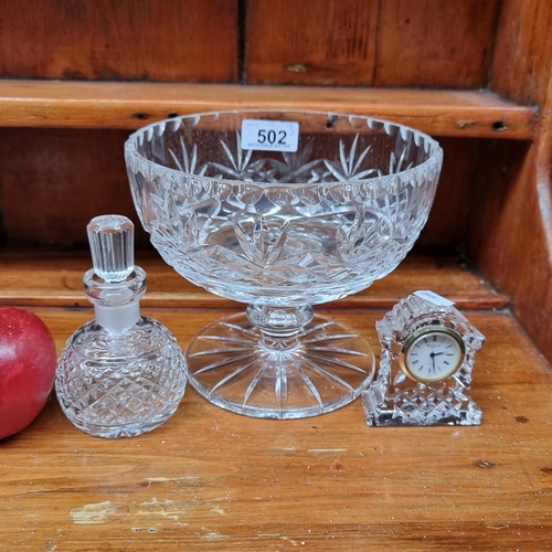 502 - A collection of three crystal items including a Waterford crystal perfume bottle with dauber and a W... 