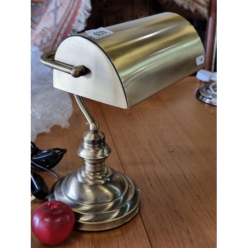 639 - A lovely brass bankers lamp with tilting shade. Really nice example.