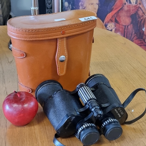 641 - A pair of Leisure Arts binoculars with 12 x 50 magnification in original hard tan leather carry case... 