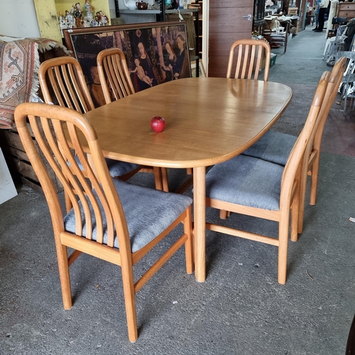 642 - A lovely large wooden dining table with attractive curved stretcher. A very clean comfortable contem... 