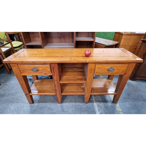 659 - A very nice golden oak sideboard, with four open shelves and two pull out drawers raised on substant... 