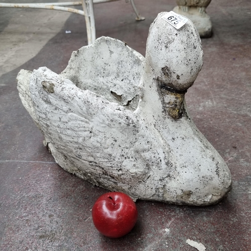 675 - A fantastic pair of very heavy planters in the form of elegant swans. One in the show room the other... 