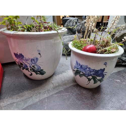 677 - Two very high quality and heavy ceramic planters, hand painted with delicate wildflowers in blues an... 