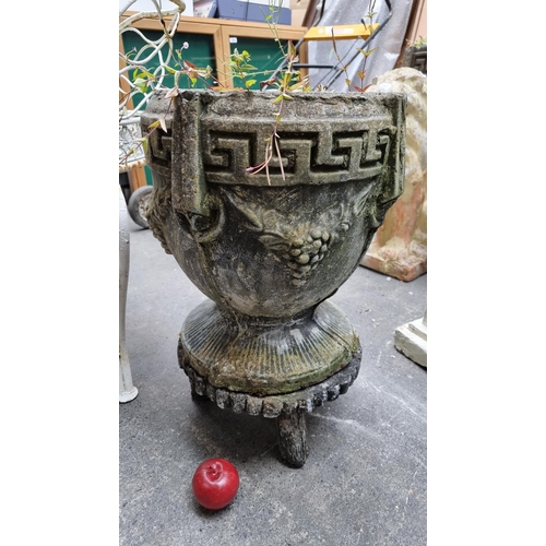 684 - A very heavy and impressive garden planter in the form of a classical Greek urn, with key boarder an... 